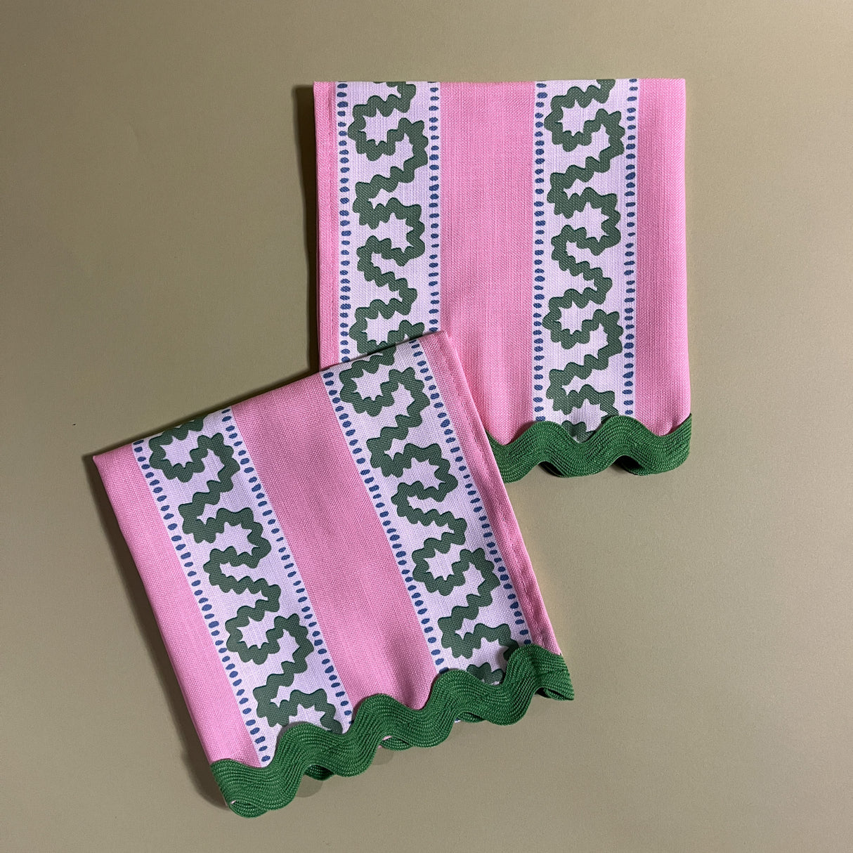 green and pink dinner napkins in the pink striped harbor trail pattern fabric from madcap cottage