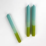 three blue and green taper candles