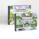 a set of two 1000 piece jigsaw puzzles featuring illustrations of the breakers and a white building in palm beach. 