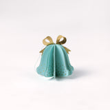 Single pastel paper Christmas bell ornaments in blue with metallic gold bows and dotted accents