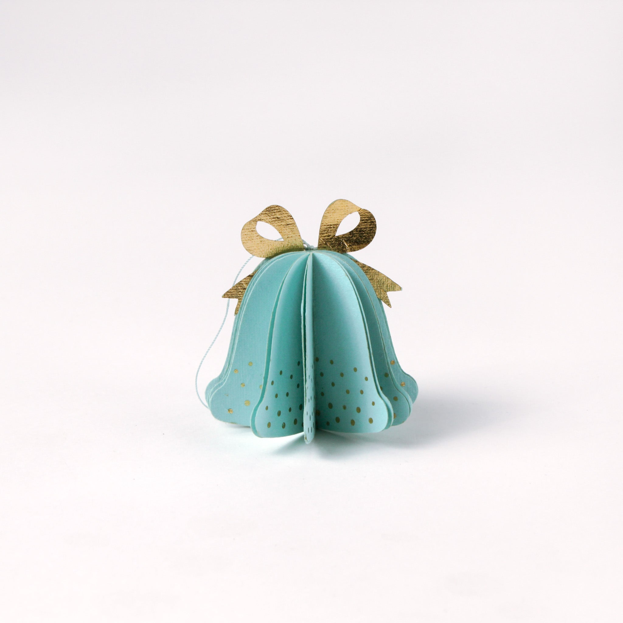 Single pastel paper Christmas bell ornaments in blue with metallic gold bows and dotted accents