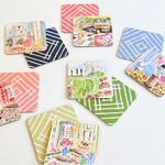 Set of colorful coasters with illustrated scenes on a white background