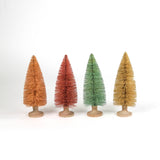 Four miniature bottle brush Christmas trees table decorations in light pink, pink, green and beige on a white background.
