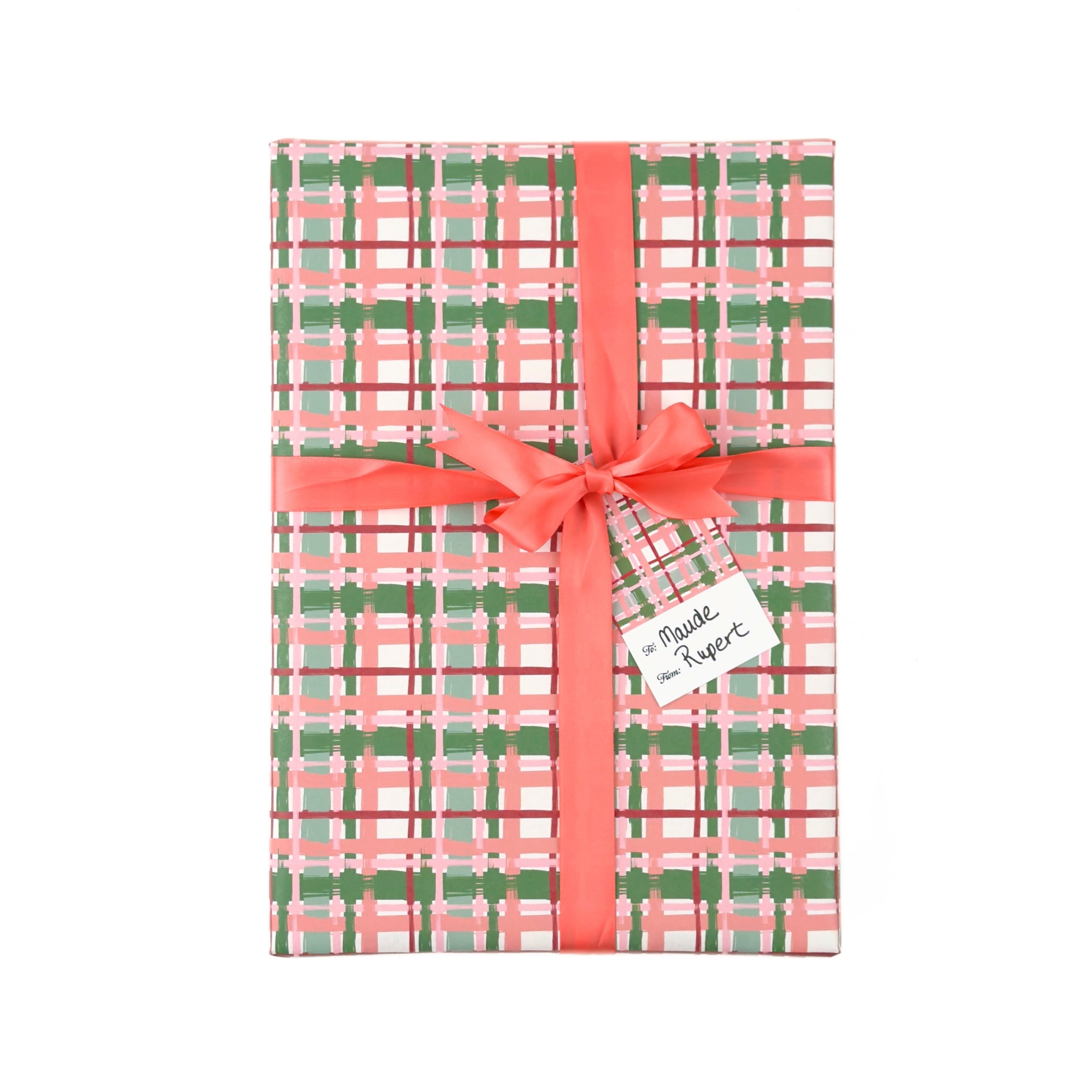 Charming gift wrap featuring peach, green, and pink plaid patterns, perfect for beautifully wrapped presents.