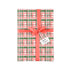Charming gift wrap featuring peach, green, and pink plaid patterns, perfect for beautifully wrapped presents.