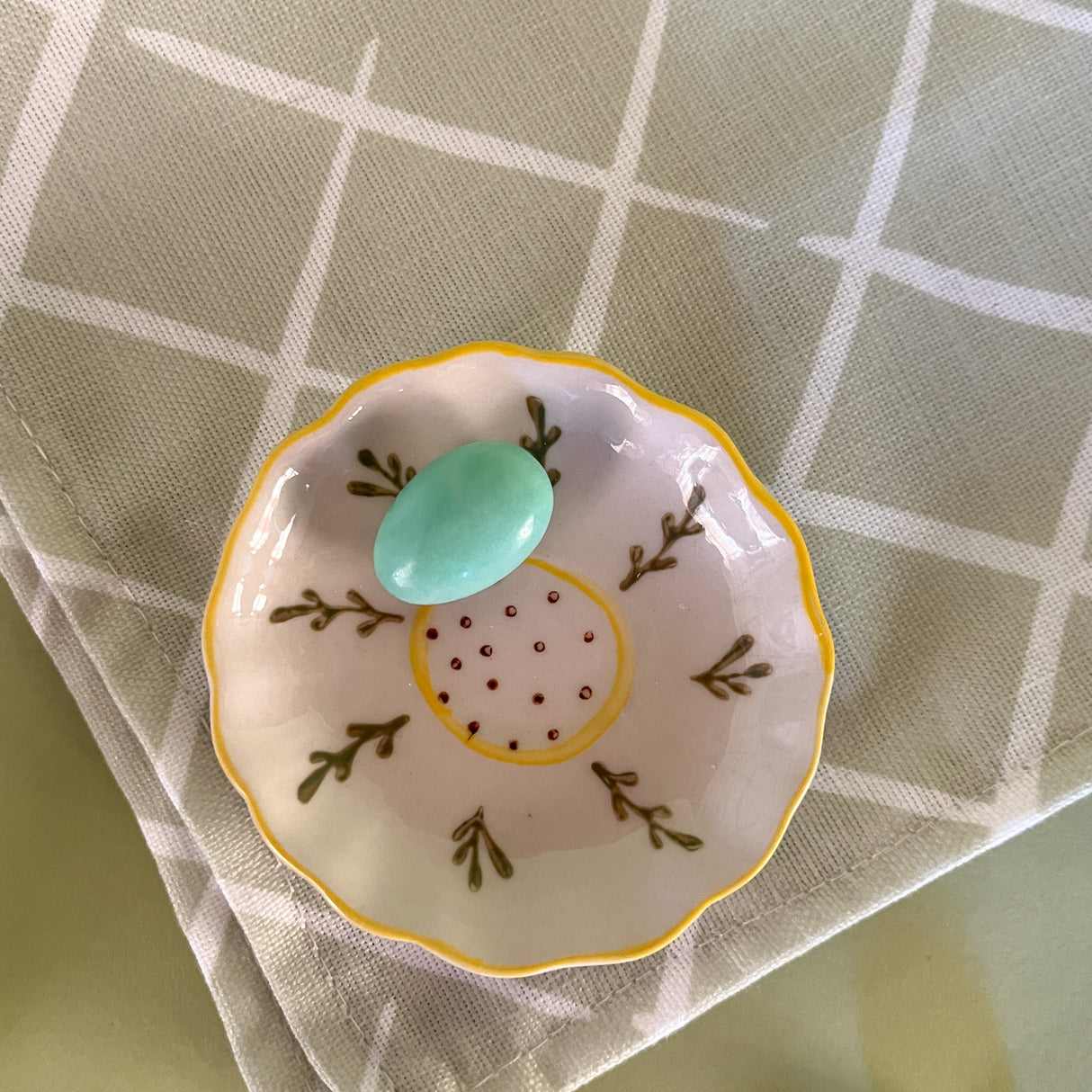 petite flower accent bowl with candy on a napkin