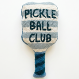 a pickleball paddle shaped pillow that is striped with navy blue text that reads pickle ball club 