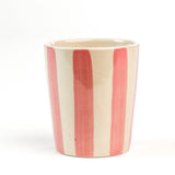 a Pink Hand-Painted Striped Ceramic Cup on a white background