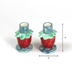 Pink strawberry candle holder with dimension of 3" x 4".