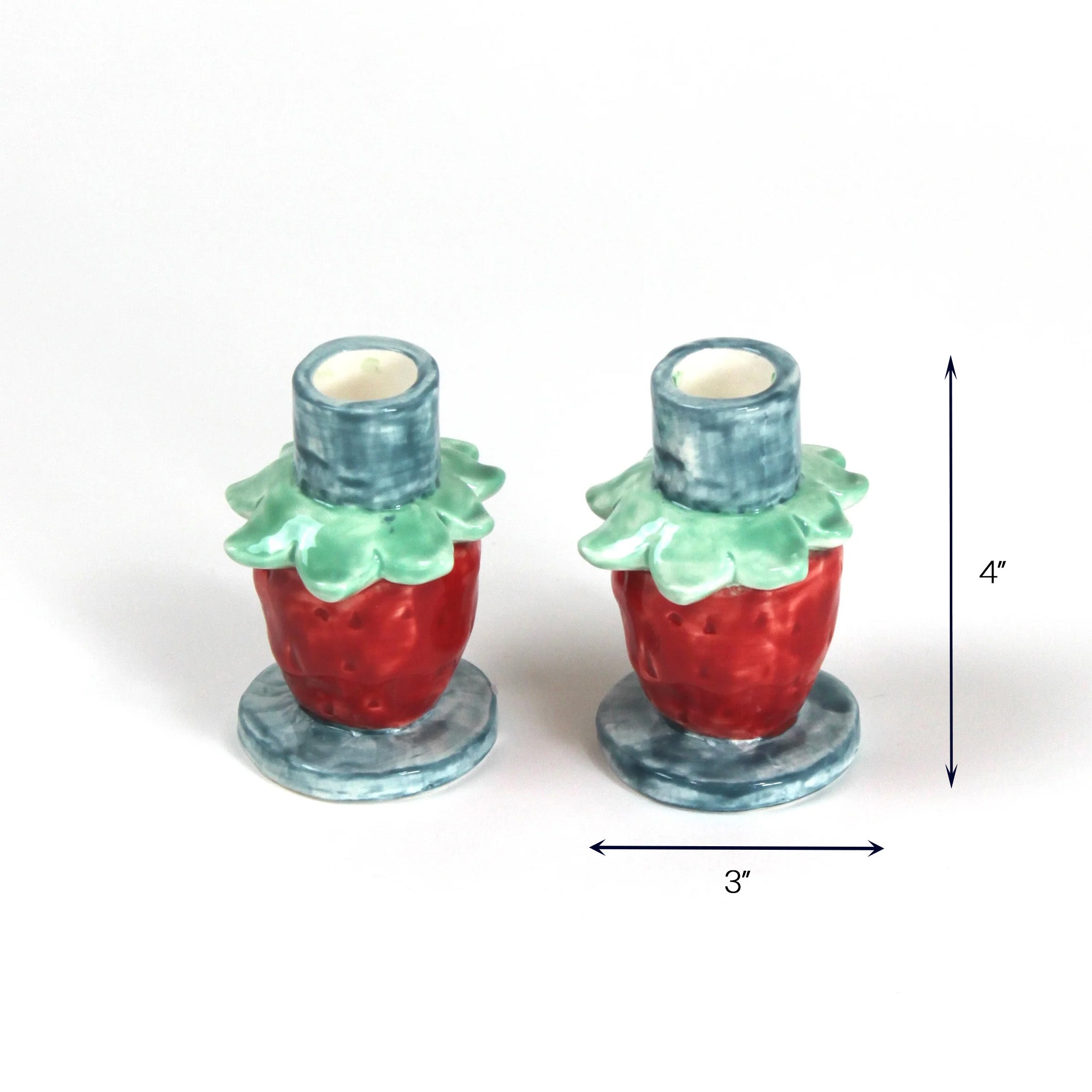 Pink strawberry candle holder with dimension of 3" x 4".