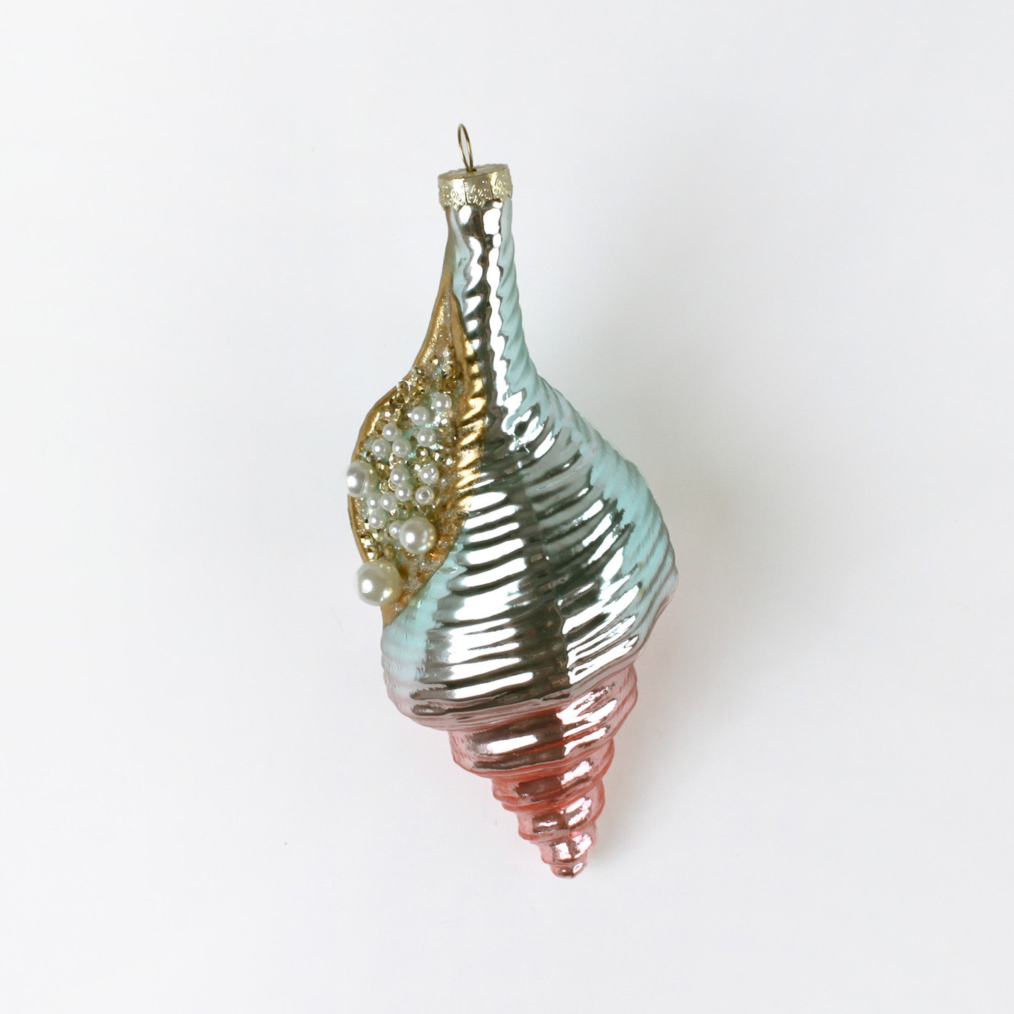 Decorative glass ornament with a spiral design on a white background