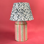 and pink and white striped lamp with a blue and white lampshade
