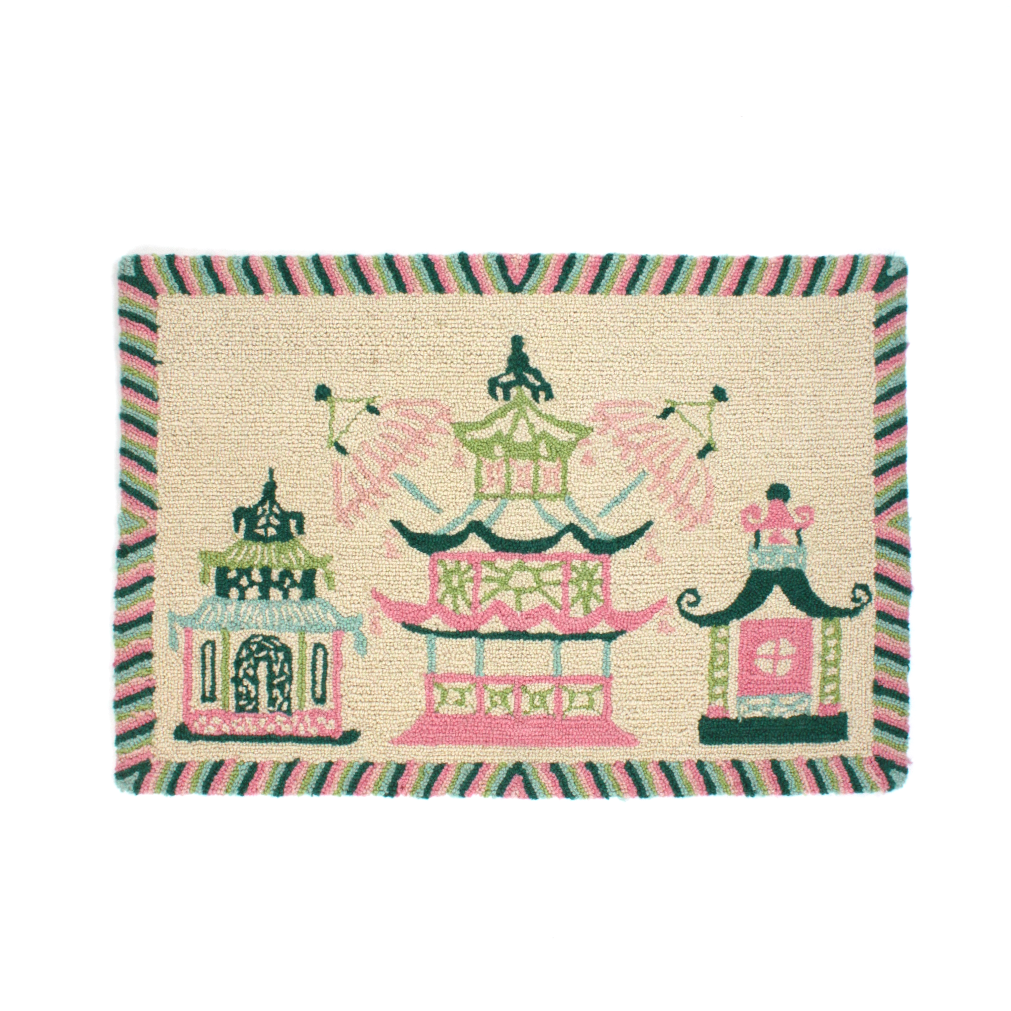 A rectangular pink and green rug with a trio of pagodas in the centre and a green striped border