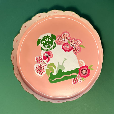 pink scalloped tray featuring a pug motif