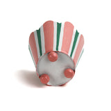 Bottom view of pink and green striped scalloped tole cachepot showing painted feet.