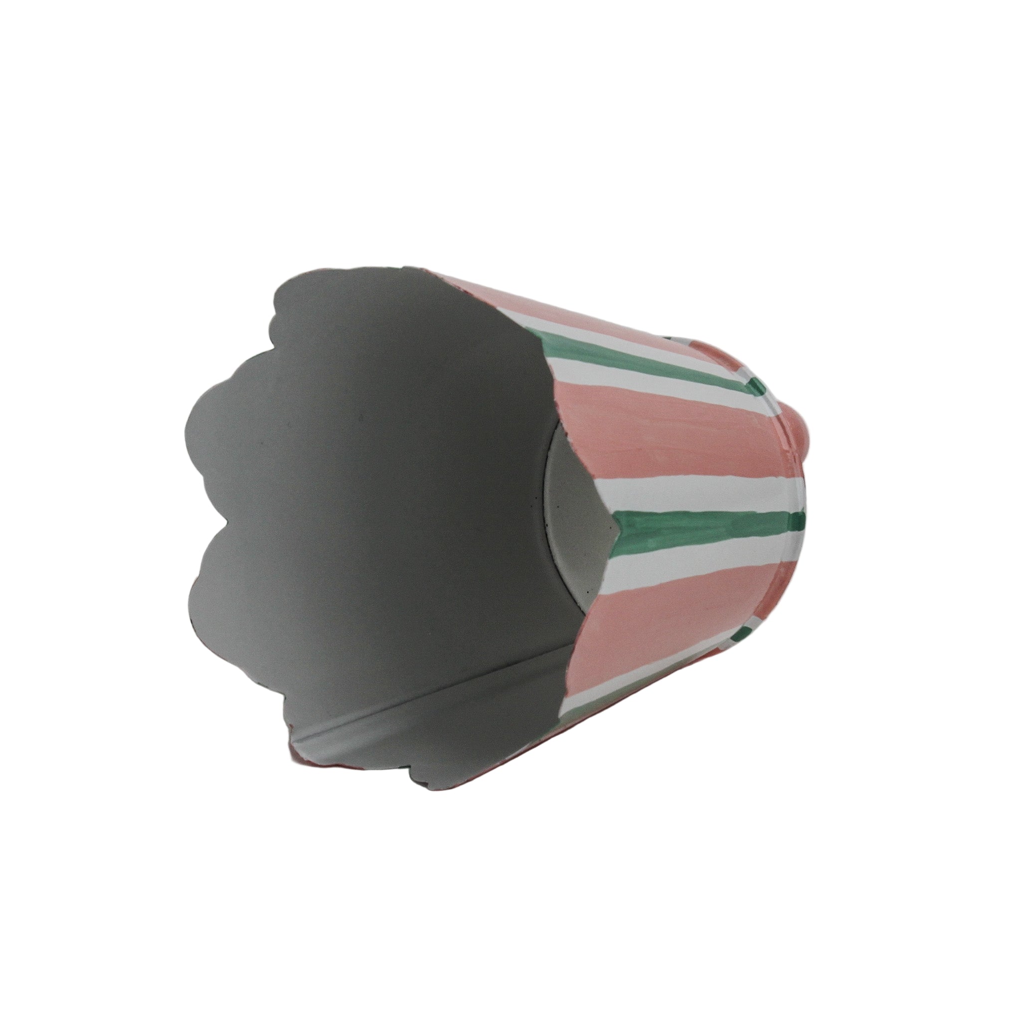 Pink and green striped scalloped tole cachepot shown on its side to display the interior.
