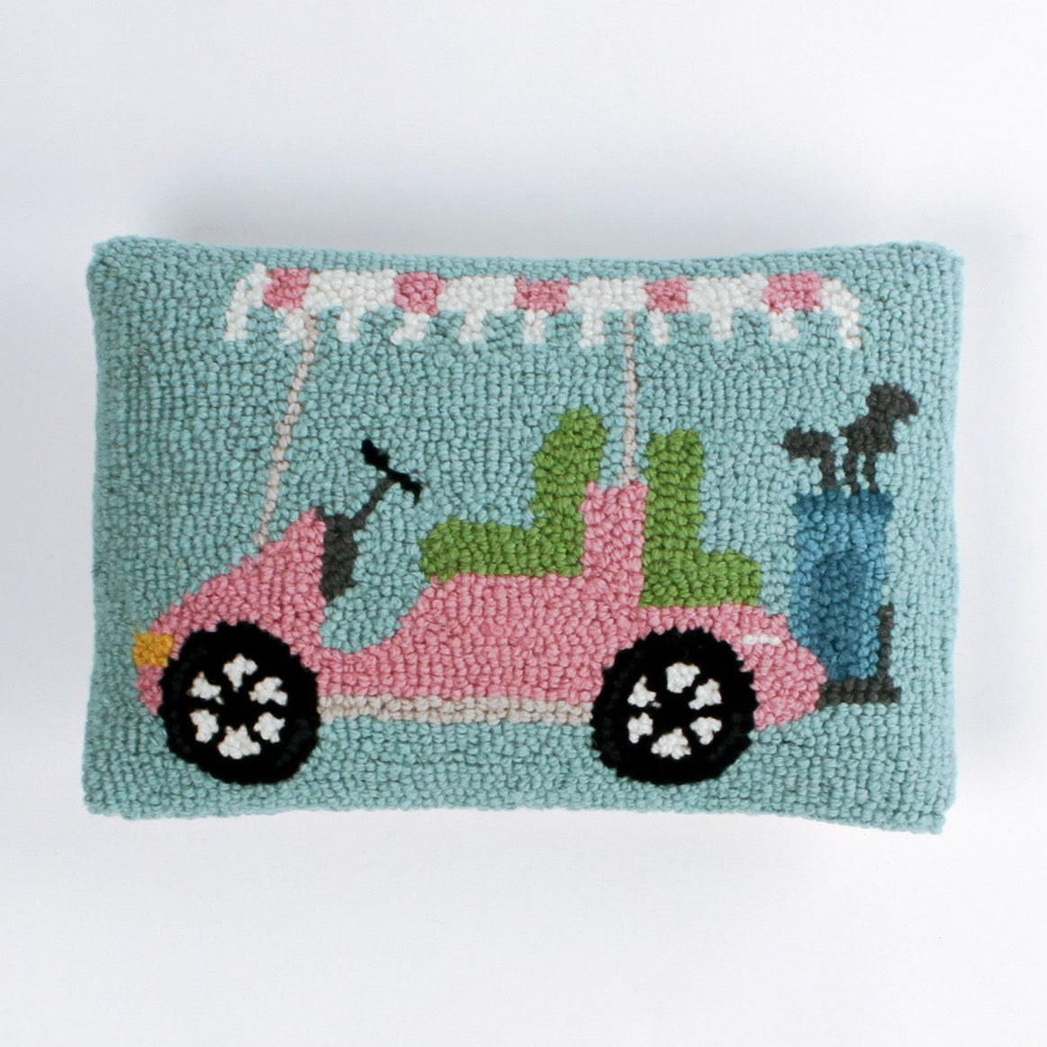 Rectangular decorative pillow with a design of a pink golf cart featuring green seats, a blue golf bag, and a pink-and-white canopy on a light blue background.
