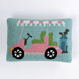 Rectangular decorative pillow with a design of a pink golf cart featuring green seats, a blue golf bag, and a pink-and-white canopy on a light blue background.