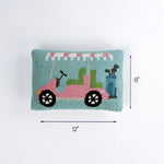 Rectangular pillow with a pink and green golf cart design shown with 12 inch length and 8 inch height.
