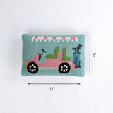 Rectangular pillow with a pink and green golf cart design shown with 12 inch length and 8 inch height.