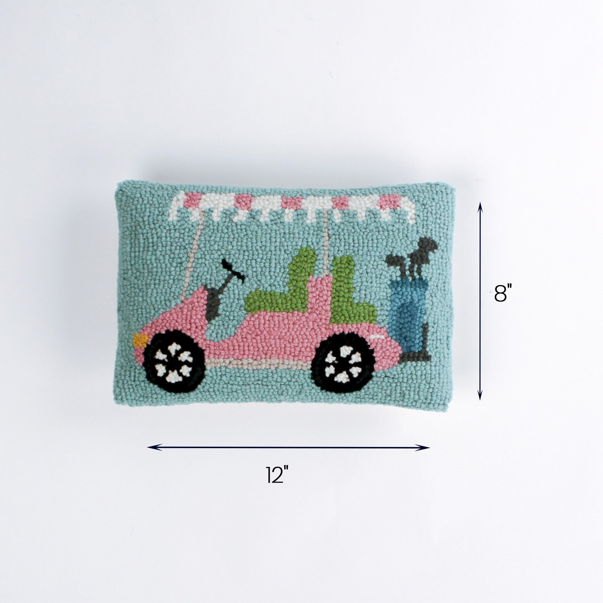 Rectangular pillow with a pink and green golf cart design shown with 12 inch length and 8 inch height.