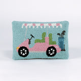 Rectangular decorative pillow with a design of a pink golf cart featuring green seats, a blue golf bag, and a pink-and-white canopy on a light blue background.