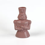 Pink ceramic nutcracker vase on a white background