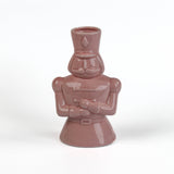 Pink ceramic nutcracker vase on a white background