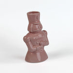 Pink ceramic nutcracker vase on a white background