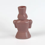 back of a Pink ceramic nutcracker vase on a white background