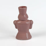 back of a Pink ceramic nutcracker vase on a white background