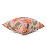 Pink tropical outdoor pillow with vibrant floral pattern.