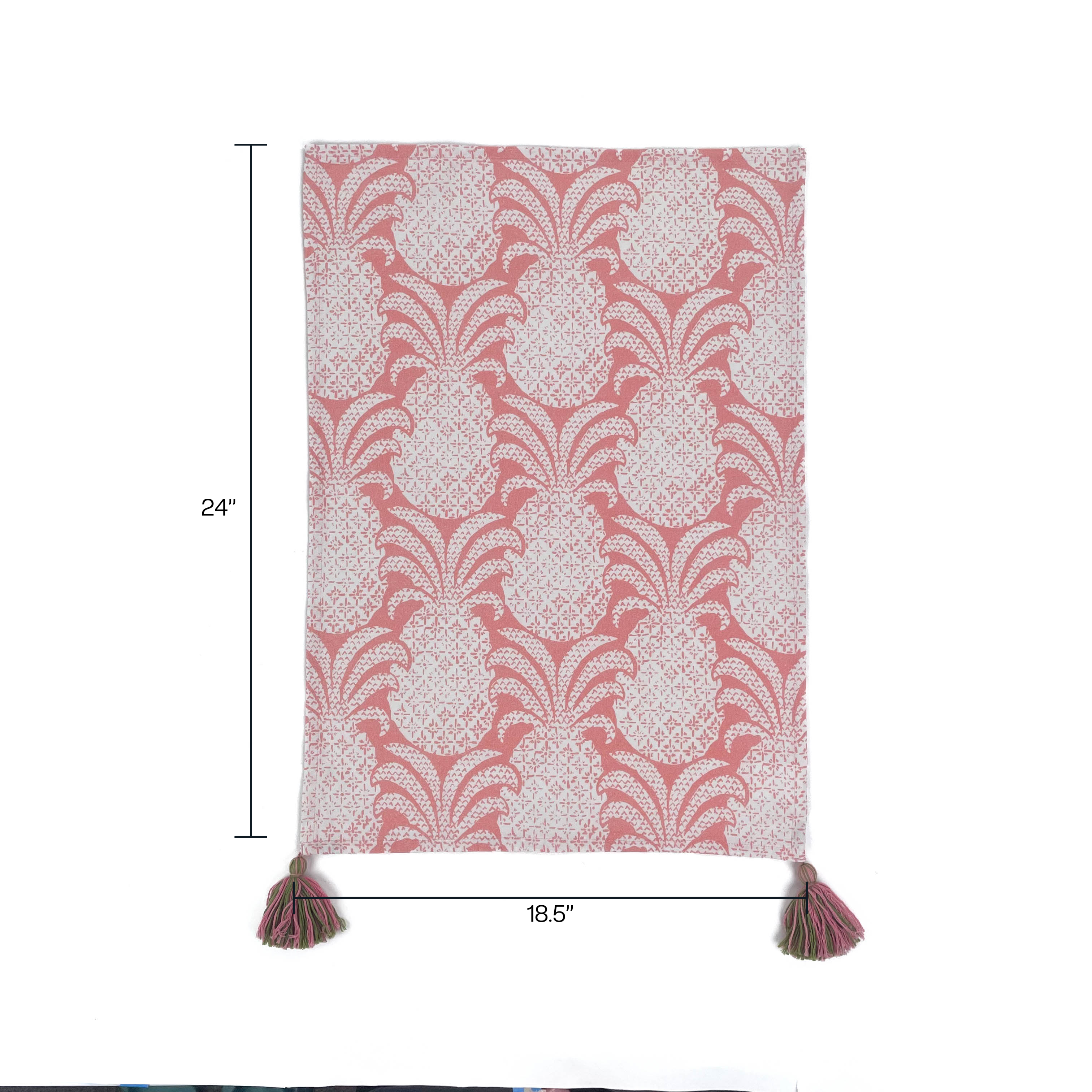 a white and pink pineapple tea towel with pink and green tassels against a white background. 