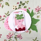 strawberry die-cut paper placemat spring table setting with white plate and strawberry napkin.