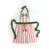Madcap Cottage Pink and White Striped apron with Christmas designs on a white background