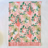 a pink chinoiserie tea towel from madcap cottage with pug and vase motifs.