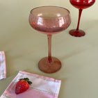 pink colored coupe glass