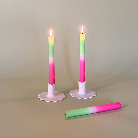 pink and green spring taper candles in white scalloped candle holders