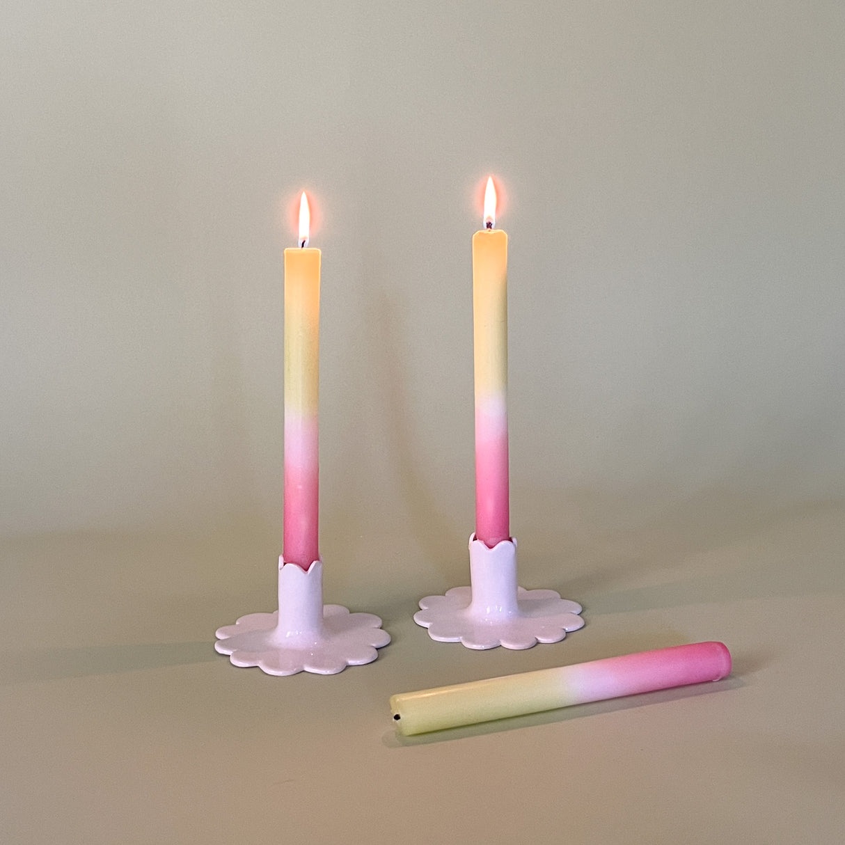 Light Green/White/Pink Color-Block Taper Candles in scalloped white candle holders