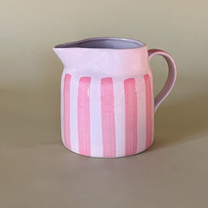 pink and white striped ceramic pitcher 