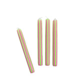 Green and pink pinstripe taper candles set with colorful vertical stripes for spring table decor.