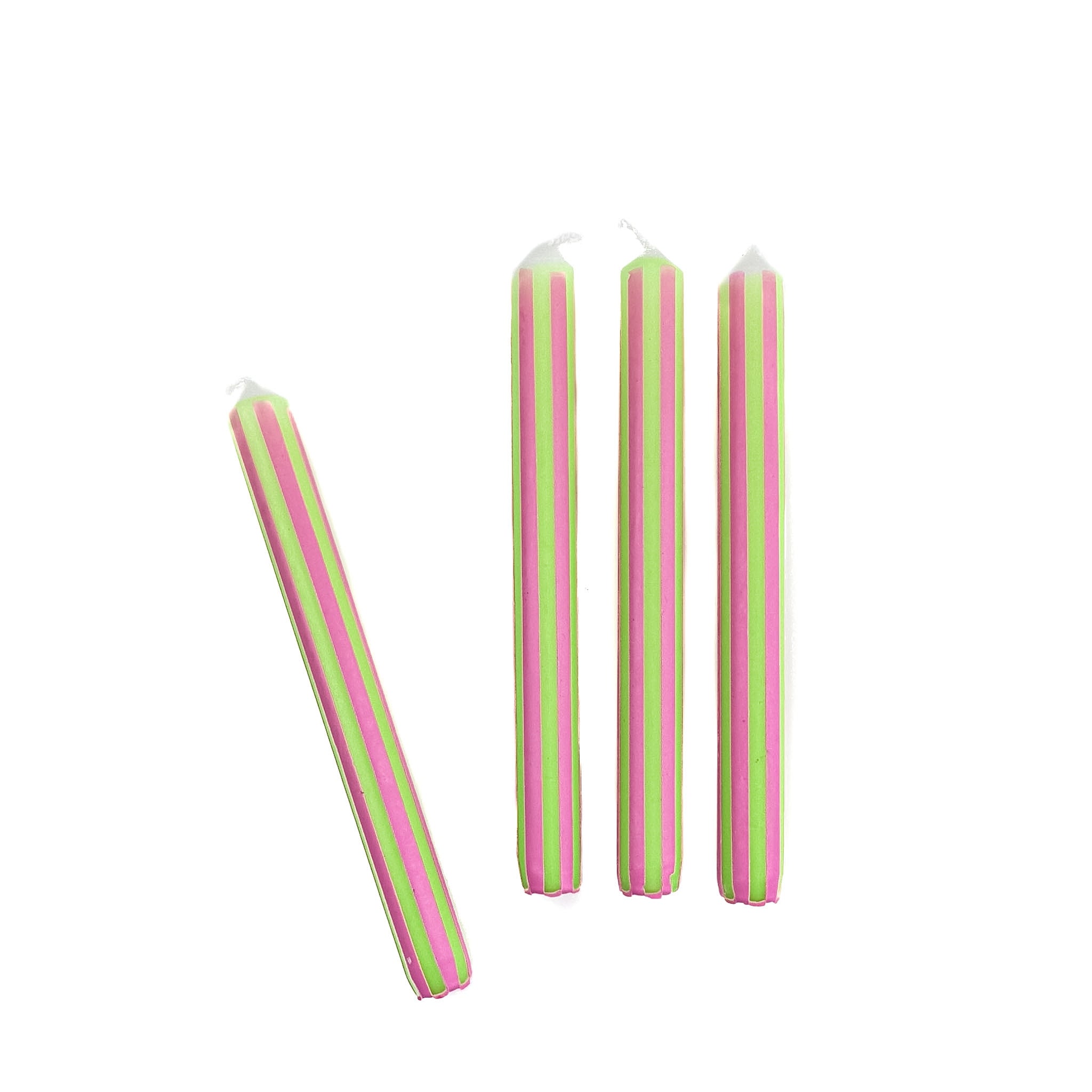 Green and pink pinstripe taper candles set with colorful vertical stripes for spring table decor.