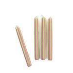 Green and pink pinstripe taper candles set with colorful vertical stripes for spring table decor.
