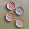 four assorted pattern plaid accent plates 