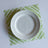 White and green paper placemats featuring a white bamboo pattern called Island House by Madcap Cottage