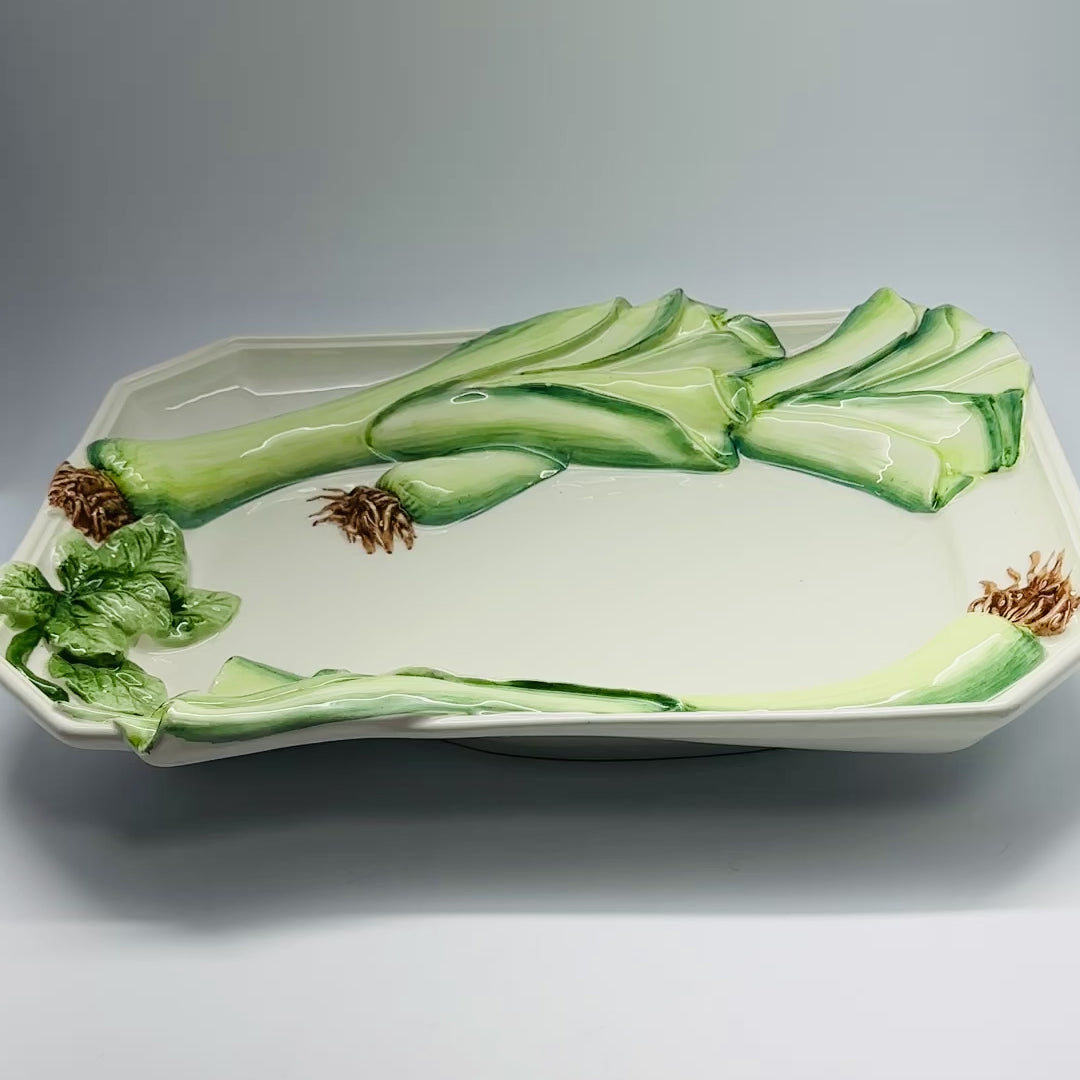 Brand new with tag4 pieces of beautiful fashion hand painted Italian leek shaped plates