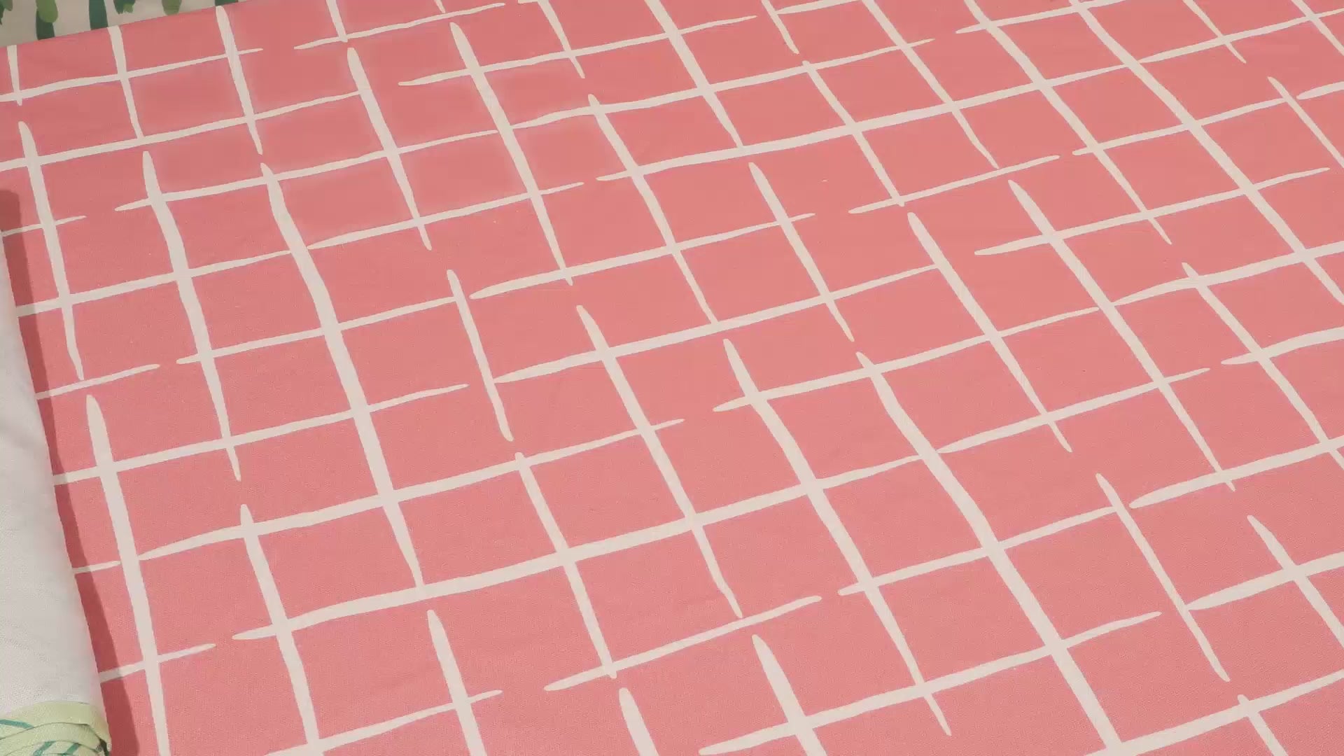 A spring tablescape video showing a table being set with easter paper placemat, pastel taper candles and fresh flowers. 