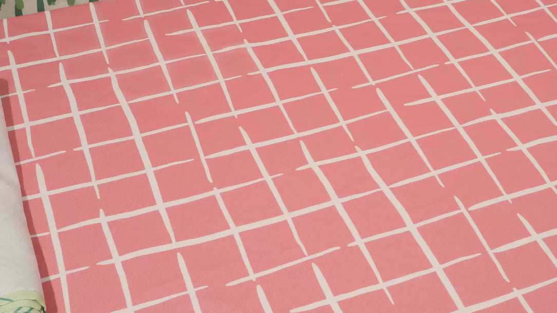 A spring tablescape video showing a table being set with easter paper placemat, pastel taper candles and fresh flowers. 