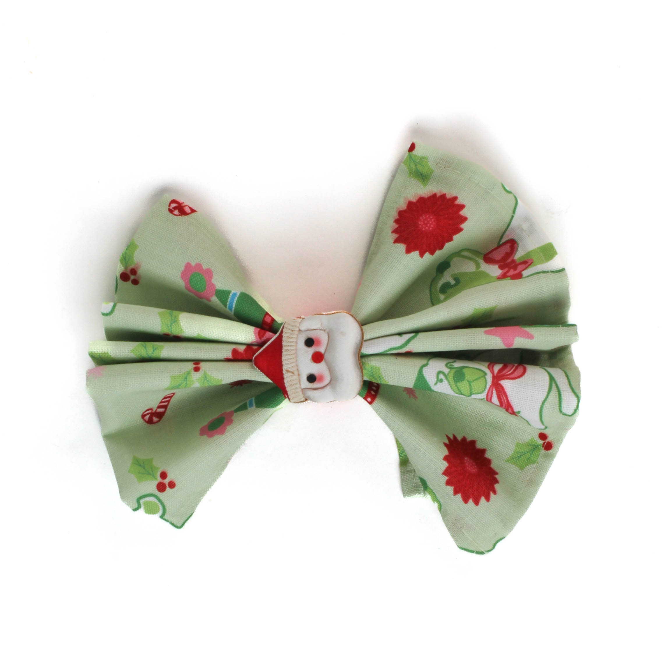 a green christmas napkins with pugs, christmas trees and candy cane motifs inside a santa napkin on a white background