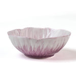 side of a purple flower shaped bowl on a white background